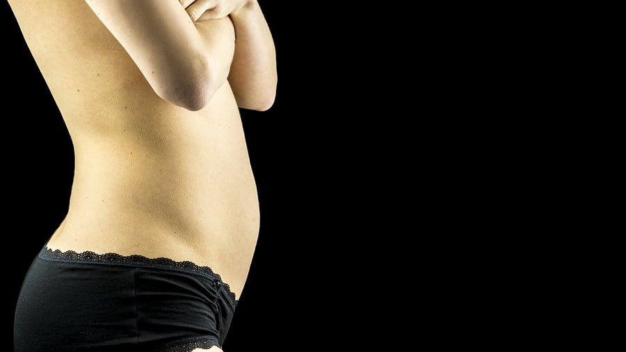 Womans Belly In Early Pregnancy