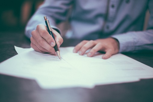 Chronic Hand Tremors Shown When Signing Papers