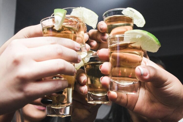 People clinking glasses