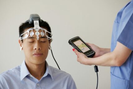 Man wearing a brain scanning device .